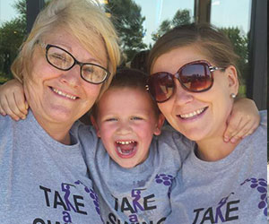 Grandma with her daughter and grandson volunteering - Multiple System Atrophy Coalition