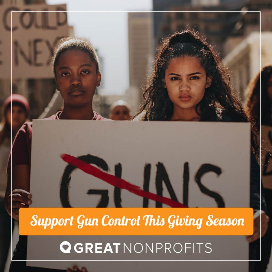 two women of color holding anti-gun sign