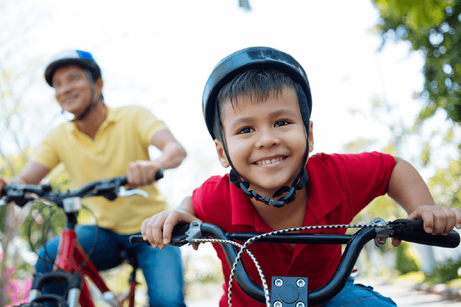 father and son riding bikes