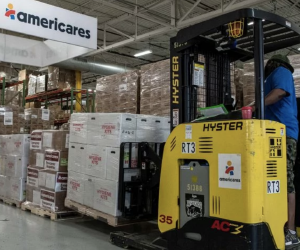 Workers at Americares distribution center in Stamford, Conn., prepare to ship relief supplies for Hurricane Dorian