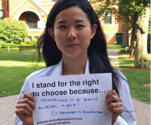 doctor holding pro choice sign