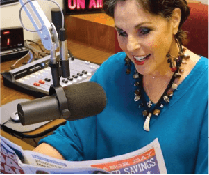 woman on the radio reading newspaper