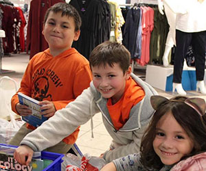 Kids at show and tell for operation schoolbell Assistance League of Omaha Nebraska