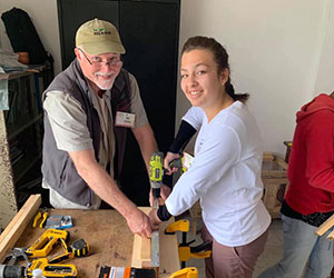 Volunteers building chicken coops Xela AID Partnerships for Self-Reliance