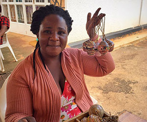 Volunteer making bead crafts BeadforLife