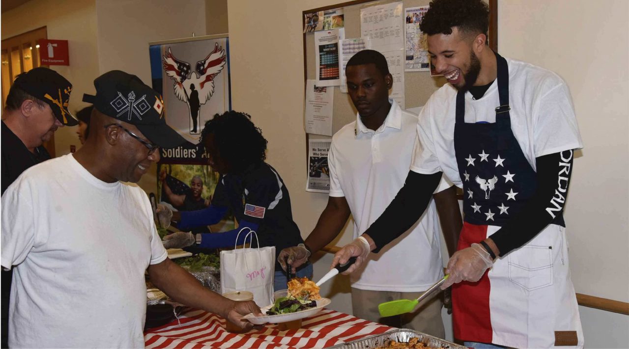 Volunteer serving meals