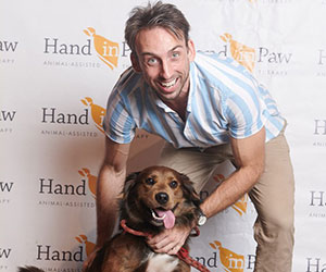 dog newly adopted Hand in Paw