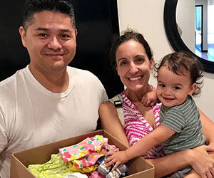 Family with a box of baby items The Childrens Healing Institute