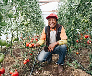 man showing the produce he grew Highland Support Project