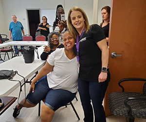 volunteer hugging a participant Saara Of Virginia Inc