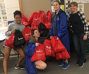 volunteers preparing donations HomeAid America Inc